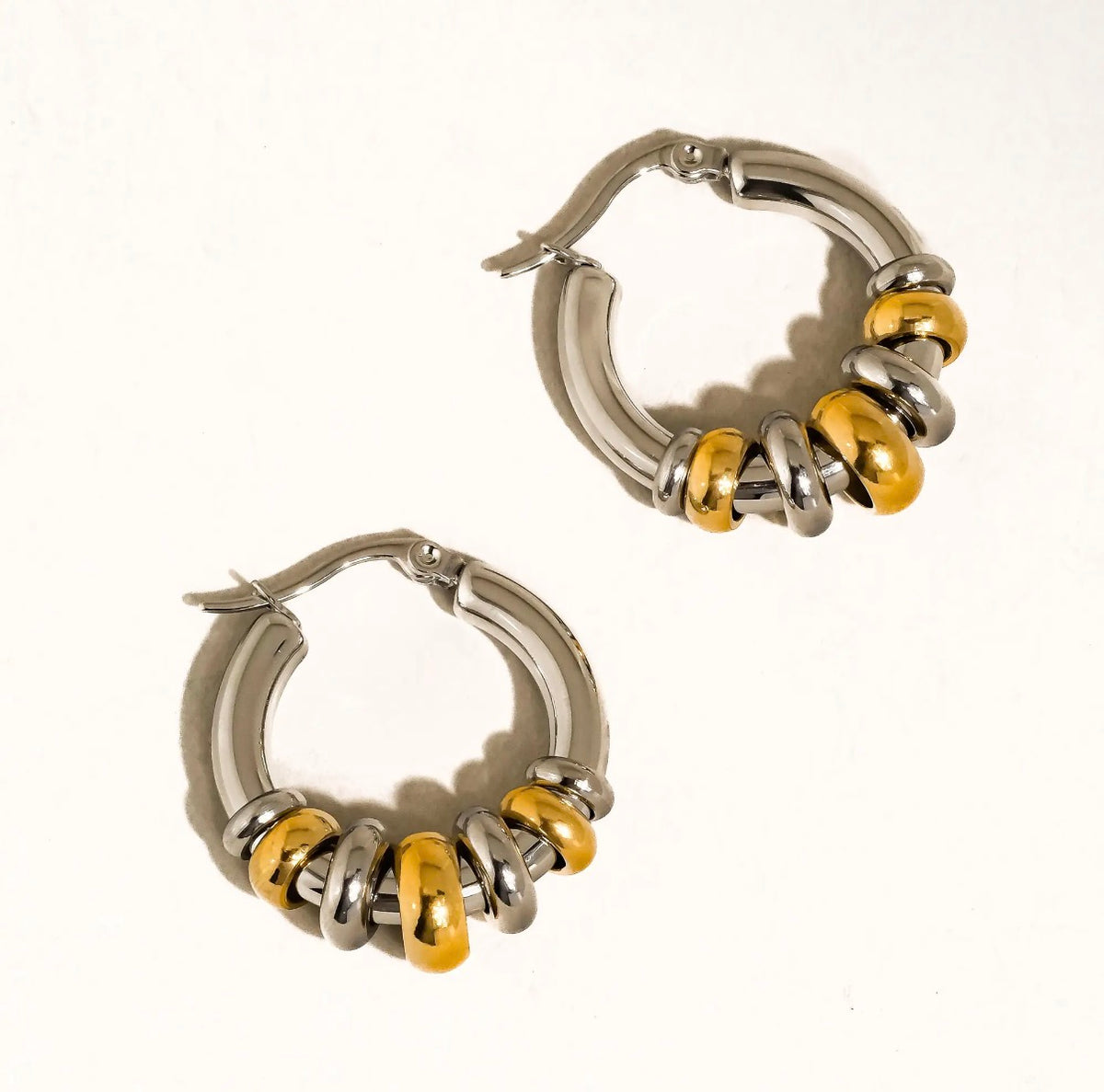 Novine two tone hoop earrings